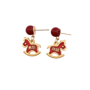 Red rocking horse earrings with Success text and gold-plated details on white background