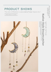 Detail of moon-shaped dream catcher with natural crystal stones and metallic sun charms
