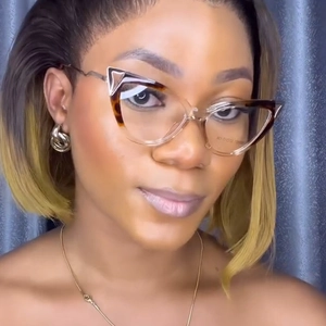 Detail of tortoise shell and clear cat-eye glasses frame with 50-17-142 specs