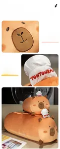 Detail of soft capybara plush pillow with chef hat and high-quality electric embroidery