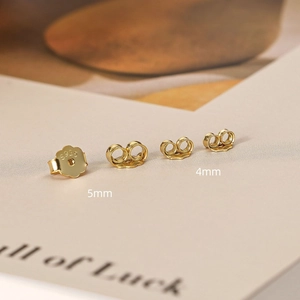 Detail view of 925 sterling silver earring backs in gold finish with S925 hallmarked stamp