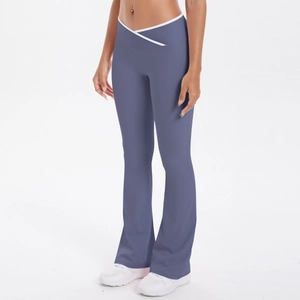 Detail of high waist V-cross waistband on flare yoga pants with white contrast piping