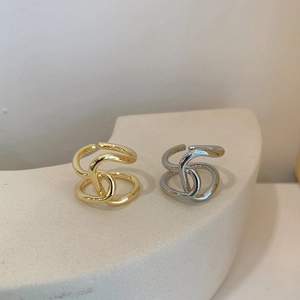 Minimalist interwoven brass open rings in gold and silver finish with geometric design