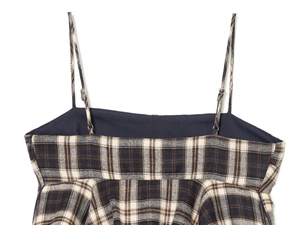 Detail of plaid camisole with adjustable straps and side hidden zipper on tweed fabric