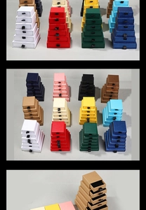 Detail of multi-color drawer jewelry boxes with ribbon pull handles and sponge liners