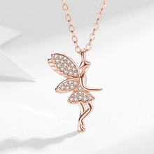 Detailed close-up of rose gold fairy pendant necklace with sparkling zircon wings and stones