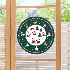 Detail of Christmas snowflake window sticker with Santa and reindeer on glass door