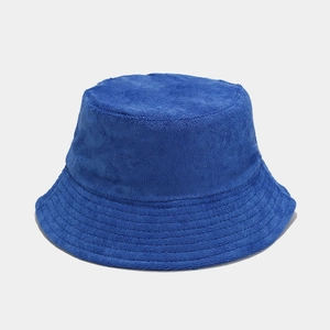 Detailed view of royal blue bucket hat featuring soft textured terry cloth fabric