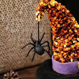 Halloween gnome hat featuring orange sequins, a purple band, and a hanging black spider