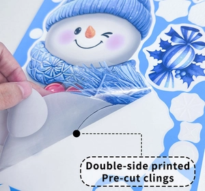Detail of pre-cut Christmas snowman static sticker showing double-sided printing feature