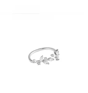 Detail of silver leaf ring featuring marquise and round cut cubic zirconia stones