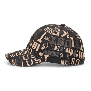 Detail view of the street style baseball cap featuring graffiti letter prints and curved brim