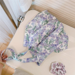 Detailed set of floral cotton tote bag and matching scrunchie with pastel flower patterns