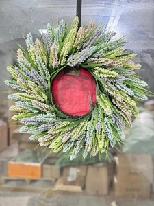 Detail of colorful artificial lavender wreath with embossed red center for home decor