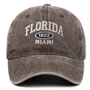 Detailed macro view of white Florida Miami 1822 3D embroidery on washed cotton baseball cap