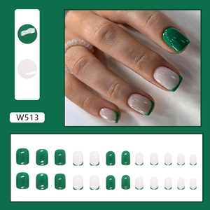 Detail view of W513 dark green press-on nails with French tip design and 24pc set layout