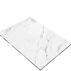 Absorbent faux marble kitchen mat with white marble texture and black stitched edges