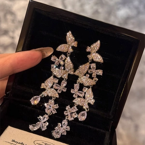 Sparkling silver needle butterfly tassel drop earrings with crystals in luxury style