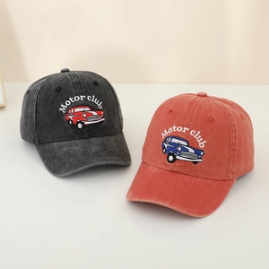 Close-up of vintage motor club car embroidery on washed cotton baseball caps