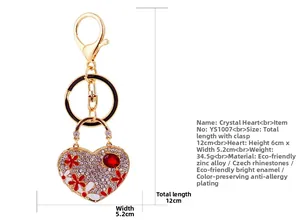 Detail showing crystal heart keychain dimensions 6x5.2cm with red enamel flower and rhinestones
