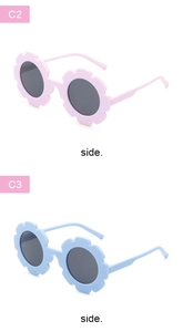 Detail view of sunflower-shaped kids sunglasses in light pink and blue matte frames