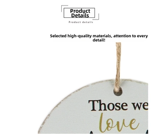 Detail of rustic wooden sign with Those we love text and natural hemp rope hanger