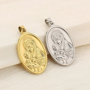 Macro detail of gold and silver religious pendant featuring Virgin Mary and Jesus relief