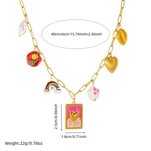 Detail shot of gold necklace with colorful enamel charms and size specifications