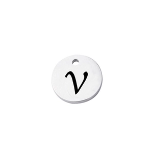 Close-up of a silver polished stainless steel round tag with letter V engraving