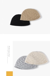 Detailed knit texture of autumn winter fisherman hats in black, khaki, grey and cream