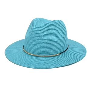 Detail of lake blue straw fedora showing fine woven texture and black ribbon with gold buckle