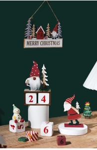 Close-up of wooden Merry Christmas hanging sign with Santa Claus and countdown calendar