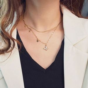 Double-layered gold titanium necklace with white butterfly pendant and small star charms