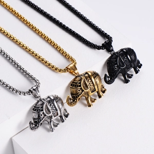 Detailed view of punk elephant pendants in silver, gold, and black finishes