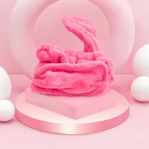 Detail showing plush pink heatless hair curler made of soft velvet material