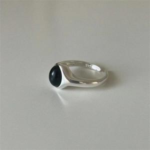 Minimalist 925 sterling silver ring with oval black onyx gemstone in a sleek design