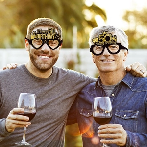 Set of two black and gold Happy 50th Birthday photo booth prop glasses for party