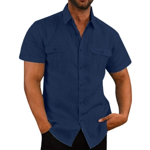 Detail of navy blue cotton linen shirt showing front double pockets and button closure
