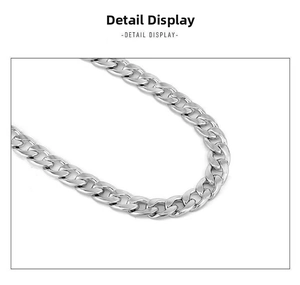 Detailed close-up of polished stainless steel silver curb chain with flat interlocking links