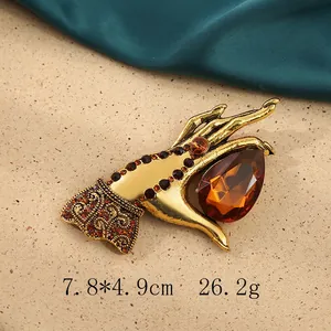 Vintage gold hand-shaped brooch with amber teardrop stone, 7.8x4.9cm, 26.2g