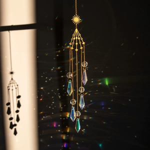 Golden sun-shaped crystal suncatcher wind chime with rainbow light reflection effect