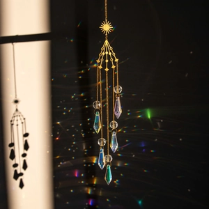 Golden sun-shaped crystal suncatcher wind chime with rainbow light reflection effect