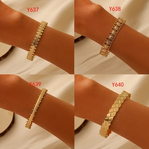 Set of four gold steel bracelets with hollow chain and evil eye patterns for women