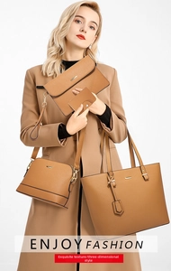 Detail view of 4-piece brown faux leather handbag set with cross-grain texture and gold hardware