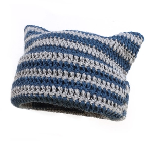 Close-up of blue and grey striped knit texture on a handmade cat ear beanie hat