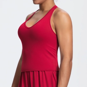 Detailed close-up of dark red V-neck yoga tank top with professional seamless stitching