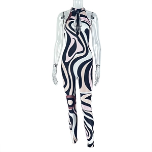 Detail of cut-out halter neckline on patterned bodysuit with pink swirl print