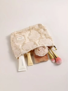 Beige linen cosmetic bag with vintage tassels and canvas texture in 45-degree view