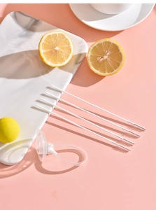 Detailed set of 5 white straw cleaning brushes with silicone nipple on marble tray