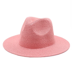 Pink straw Panama hat for women featuring classic wide brim and fine woven texture